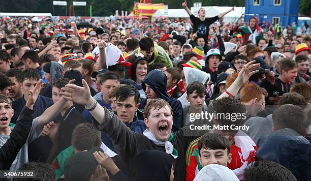 Welsh fans gather to watch the UEFA EURO 2016 Group B match between England and Wales on June 16, 2016 in Cardiff, Wales. Having beaten Slovakia in...