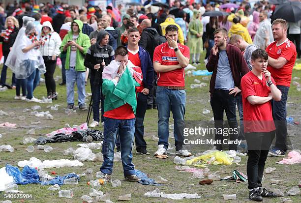 Welsh fans react at the end of the UEFA EURO 2016 Group B match between England and Wales on June 16, 2016 in Cardiff, Wales. Having beaten Slovakia...