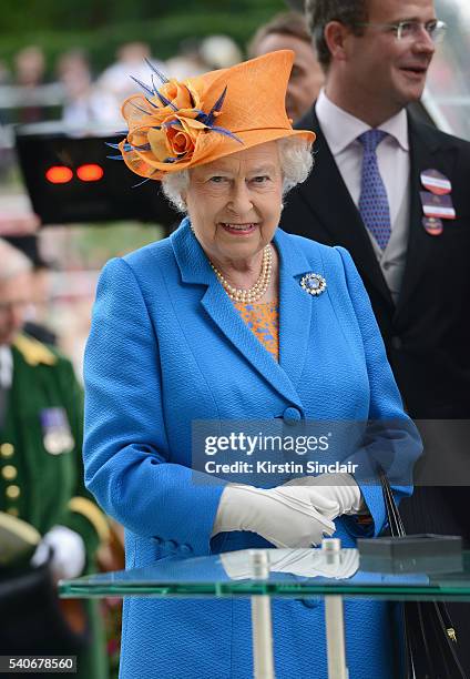 Queen Elizabeth II presents The Gold Cup Trophy, in Honour of The Queen's 90th Birthday, to winning horse Order of St George on day 3 of Royal Ascot...