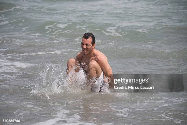 Alex De Angelis of Rep. San Marino and IodaRacing Team swimming during the pre-event on the beach in Misano Adriatico during the FIM Superbike World...