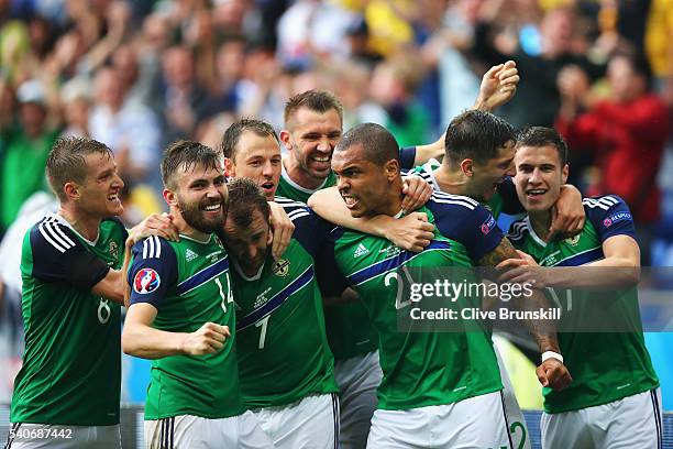 Niall McGinn of Northern Ireland celebrates scoring his team's second goal with his team mates during the UEFA EURO 2016 Group C match between...