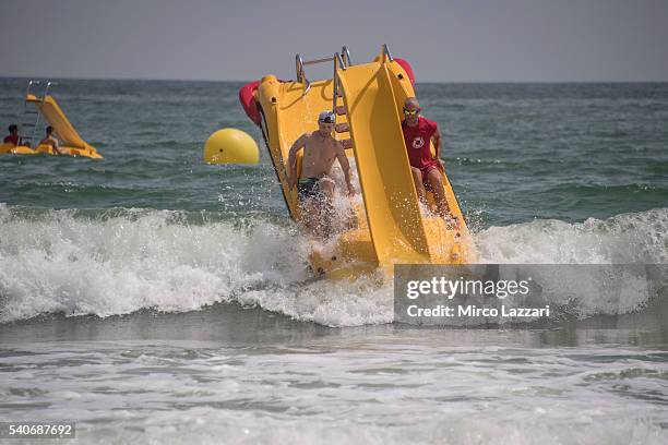 Jonathan Rea of Great Britain and KAWASAKI RACING TEAM arrives and celebrates during the pre-event on the beach in Misano Adriatico during the FIM...