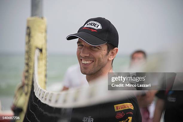 Alex De Angelis of Rep. San Marino and IodaRacing Team smiles during the pre-event on the beach in Misano Adriatico during the FIM Superbike World...