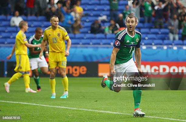 Niall McGinn of Northern Ireland celebrates scoring his team's second goal during the UEFA EURO 2016 Group C match between Ukraine and Northern...