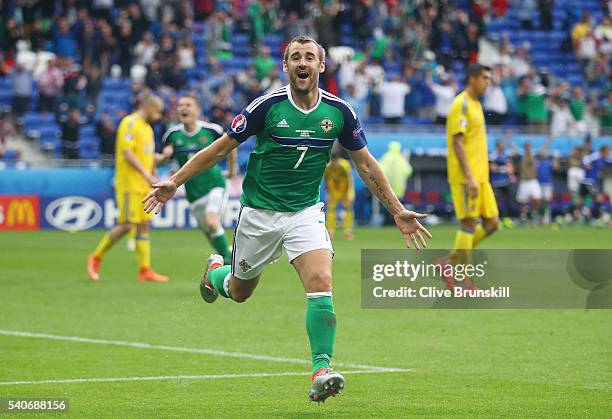 Niall McGinn of Northern Ireland celebrates scoring his team's second goal during the UEFA EURO 2016 Group C match between Ukraine and Northern...