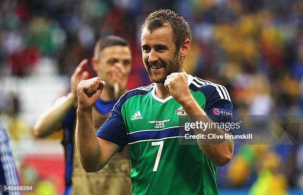 Niall McGinn of Northern Ireland celebrates his team's 2-0 win in the UEFA EURO 2016 Group C match between Ukraine and Northern Ireland at Stade des...