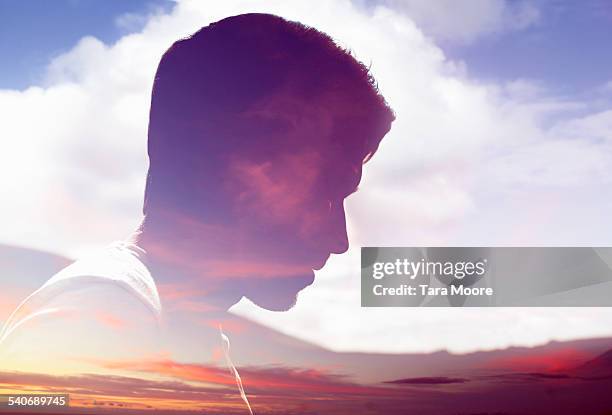 male face silhouetted in sky - magical thinking stock pictures, royalty-free photos & images