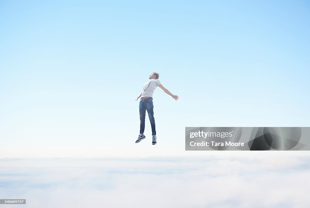 Man floating in sky