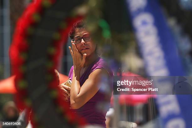 Woman visits a memorial for those killed in the Pulse nightclub shooting on June 16, 2016 in Orlando, Florida. Omar Mir Seddique Mateen, reportedly...