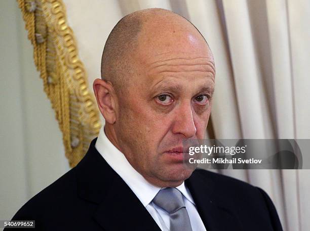 Russian billionaire and businessman, Concord catering company owner Yevgeny Prigozhin attends a meeting with foreign investors at Konstantin Palace...