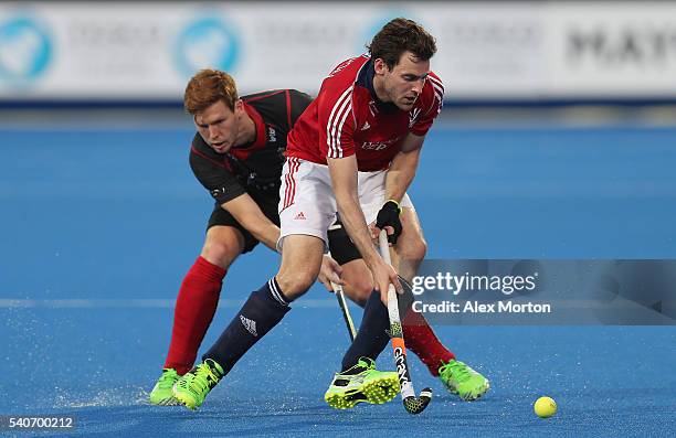 Alistair Brogdon of Great Britain and Gauthier Boccard of Belgium during the FIH Mens Hero Hockey Champions Trophy match between Great Britain and...