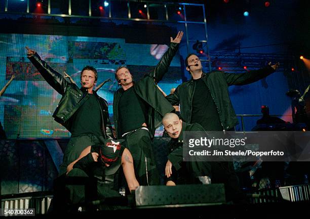 Ritchie Neville, Jason Paul Brown and Scott Robinson, Abz Love and Sean Conlon of Five performing on stage during the Brit Awards held at Earls Court...