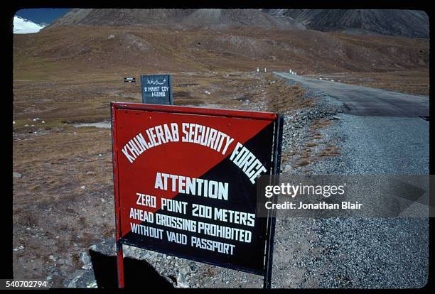 The Pakistan - China high altitude border sign on Karakoram Highway, Khunjerab Pass, Khunjerab National Park, Gojal, Pakistan.