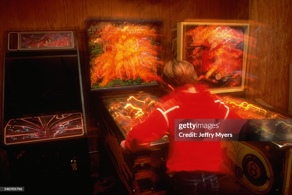 Boy Playing Pinball