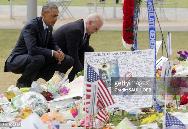 President Barack Obama and Vice President Joe Biden place flowers for the victims of the mass shooting at a gay nightclub Sunday at a memorial at the...