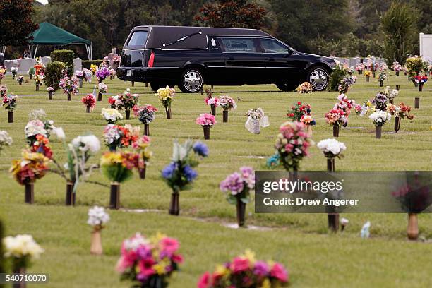 Hearse that carried the body of Kimberly Morris drives through the cemetery after the burial for Morris, June 16, 2016 in Kissimmee, Florida. Morris,...