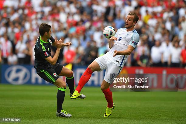 Harry Kane of England challenges Ben Davies of Wales during the UEFA Euro 2016 Group B match between England and Wales at Stade Bollaert-Delelis on...