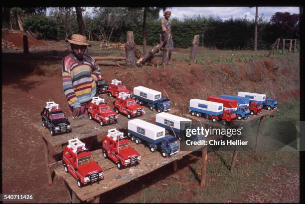 vendor selling toy trucks - 20th century model car stock pictures, royalty-free photos & images