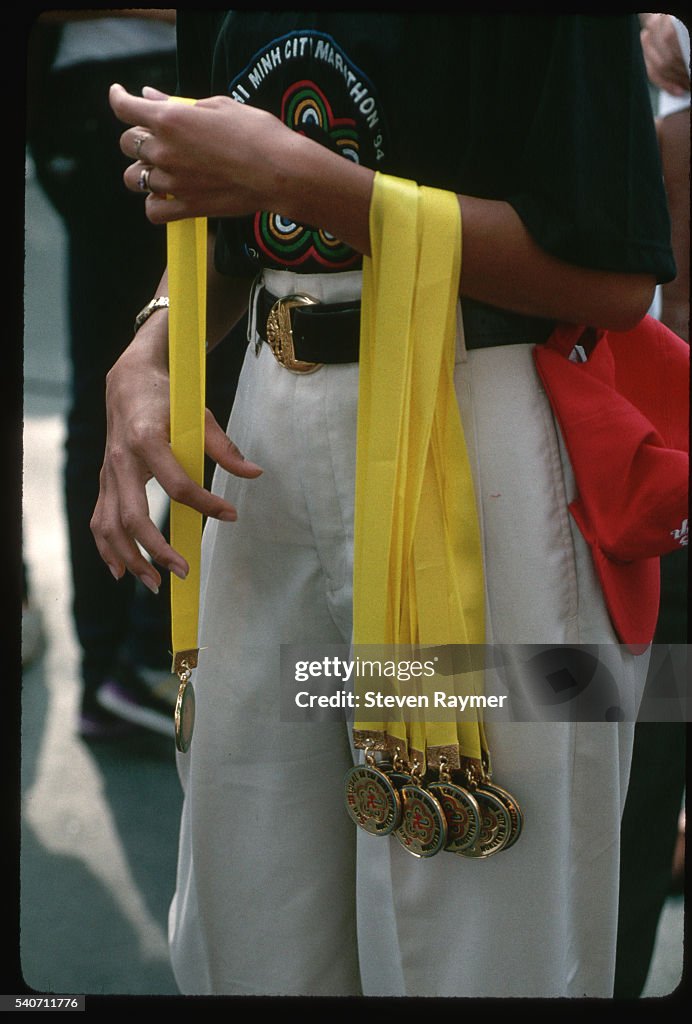 Woman Holding Medals