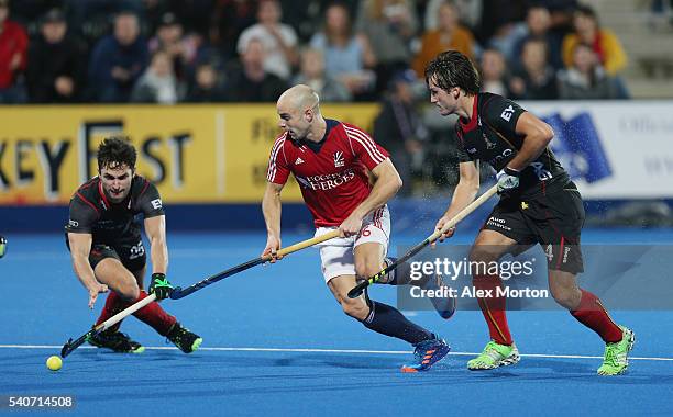 Loick Luypaert of Belgium, Nick Catlin of Great Britain and Arthur van Doren during the FIH Mens Hero Hockey Champions Trophy match between Great...