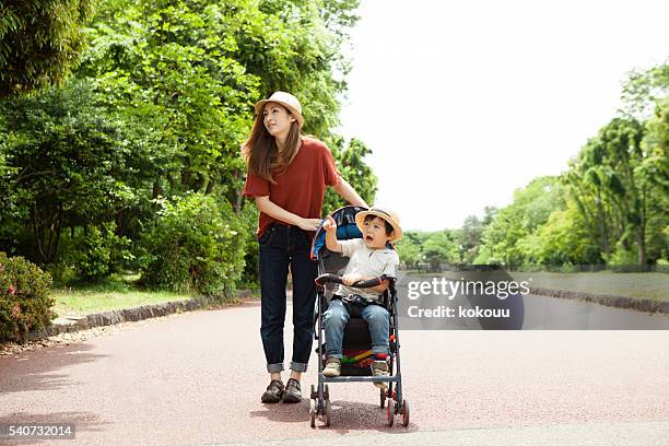 mother and children have come to play in holiday park - trip hazard stock pictures, royalty-free photos & images