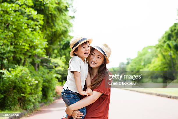 boy is laughing while being faced to mother - trip hazard stock pictures, royalty-free photos & images