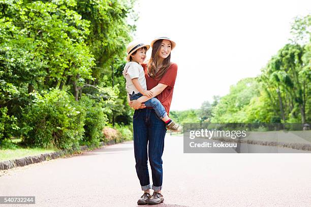 boy that has been faced in the mother in park - trip hazard stock pictures, royalty-free photos & images
