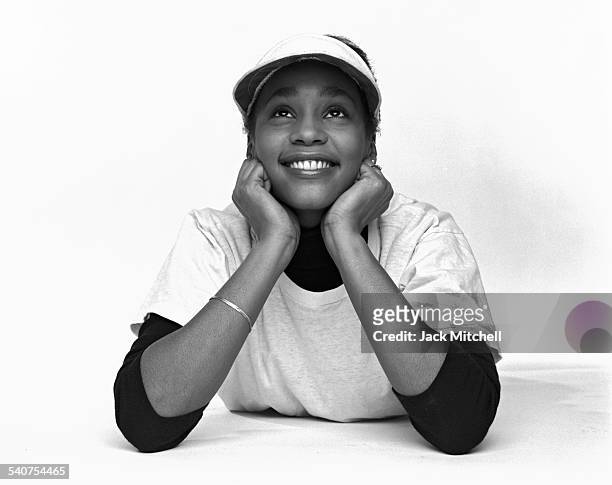 Singer Whitney Houston photographed in February 1982 when she was a senior in high school .