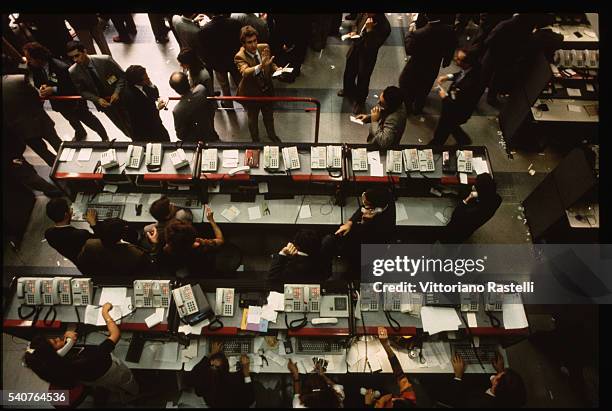 Frantic stock traders at the Milan stock exchange.