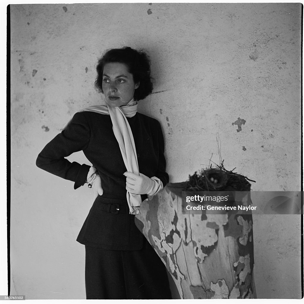 Actress Vivica Lindfors Modeling a Forstmann Rust Brown Wool Suit with Scarf of Chamois by Maxmilian