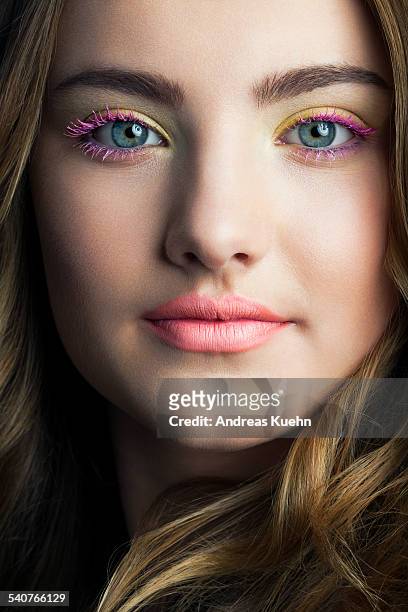 close up of teenage girl with colorful make up. - mascara stockfoto's en -beelden