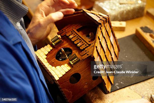 production of original german cuckoo clock - cuckoo clock stock pictures, royalty-free photos & images