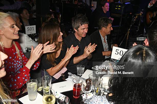 Poppy Delevingne, Sara MacDonald, Noel Gallagher and Tim Bevan attend 'Hoping's Greatest Hits', the 10th anniversary of The Hoping Foundation's...