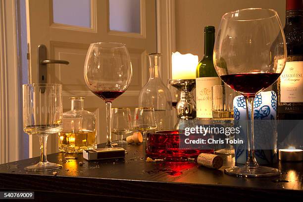 table half empty glasses after party - empty glasses after party stock pictures, royalty-free photos & images