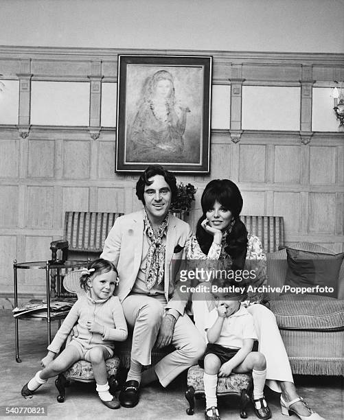 English actor, singer and songwriter Anthony Newley and his wife, English actress Joan Collins at home with their children Tara and Sacha , 19th July...