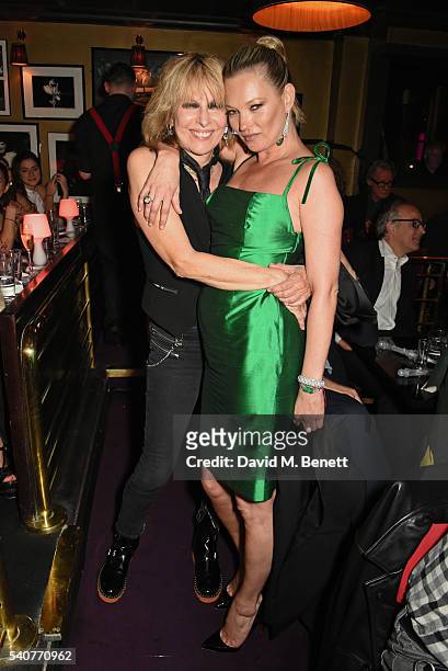 Chrissie Hynde and Kate Moss pose following their performance of "Stand By Your Man" at 'Hoping's Greatest Hits', the 10th anniversary of The Hoping...