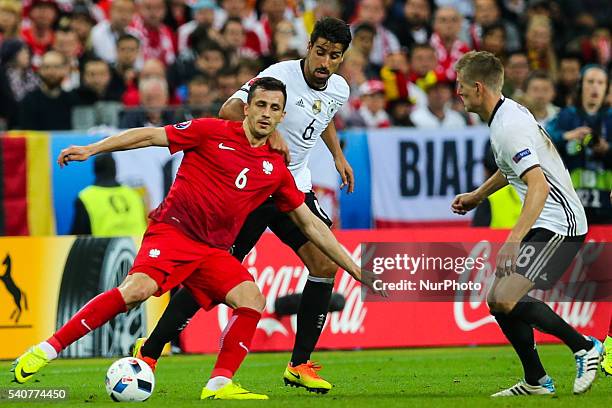 Tomasz Jodlowiec , Sami Khedira , Toni Kroos during the UEFA EURO 2016 Group C match between Germany and Poland at Stade de France on June 16, 2016...