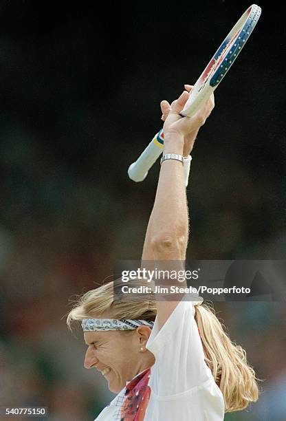 Steffi Graf of Germany raises her racquet and celebrates her victory over Arantxa Sanchez Vicario after their Women's Singles final match at the...