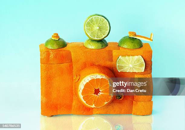 orange camera - food sculpture stock pictures, royalty-free photos & images