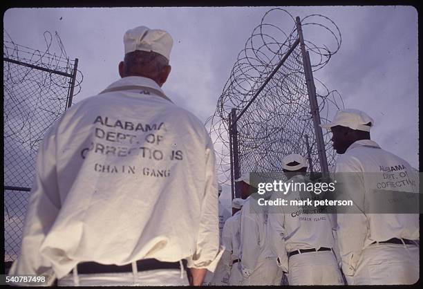 Huntsville, Alabama: Limestone Correctional Facility inmates work on chain gang, break rocks and do roadwork. After a day's work, inmates are...