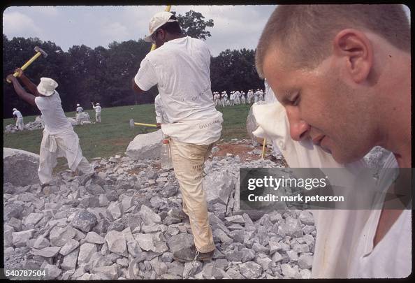 Prrisoner Breaking Rocks Inmates From The Limestone Correctional Facility On A Chain Gang. The ...