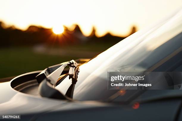 car on road - windshield wiper stock pictures, royalty-free photos & images