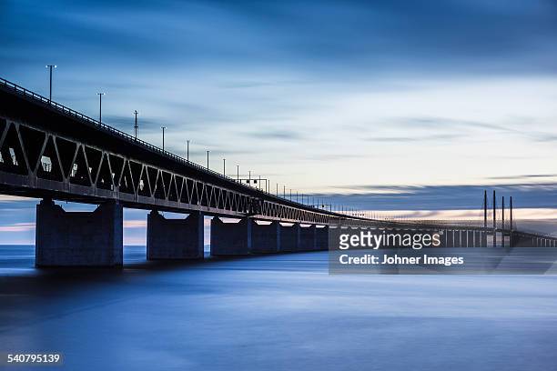 bridge at dusk, low angle view - oresund bridge stock pictures, royalty-free photos & images