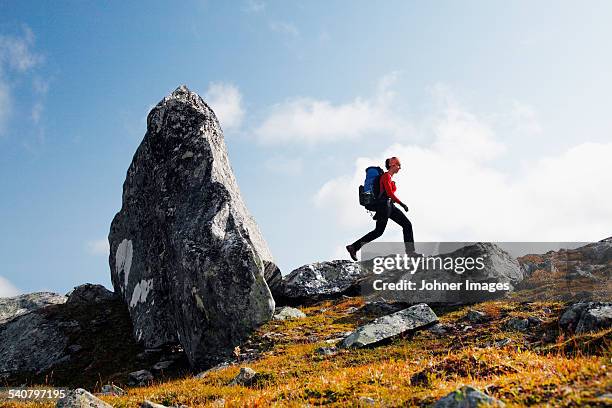 young woman hiking - large rucksack stock pictures, royalty-free photos & images