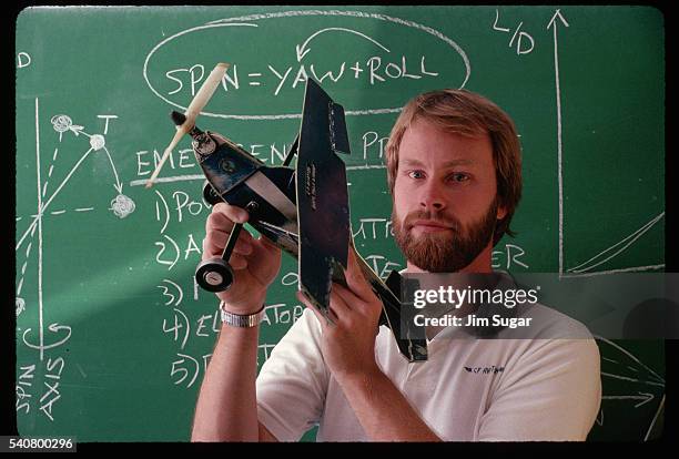 flight instructor holding a model plane - visual tricks stock pictures, royalty-free photos & images