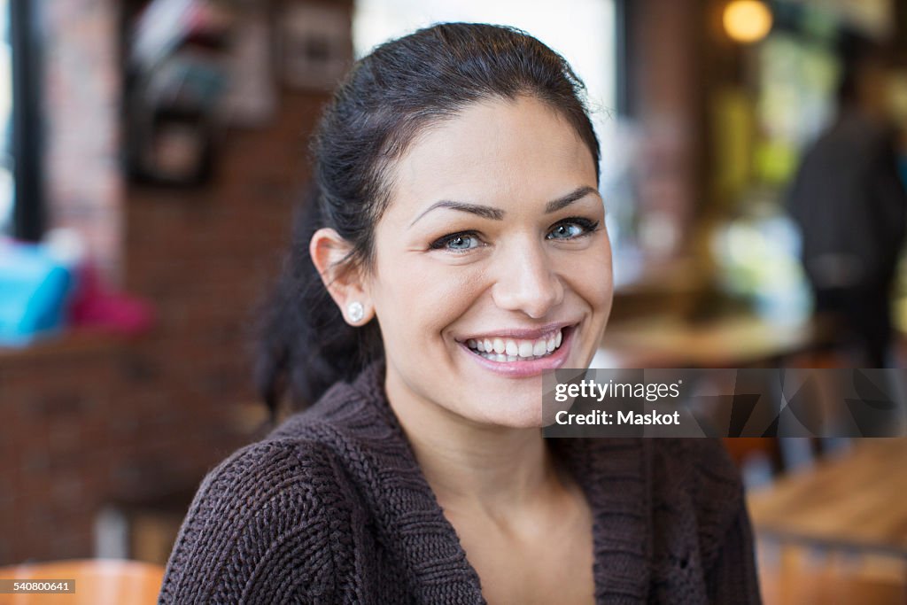 Portrait of smiling mid adult woman in restaurant