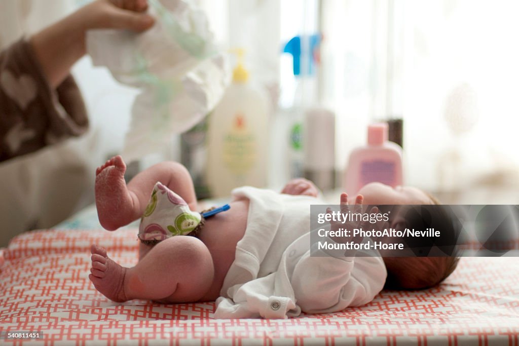 Baby getting diaper changed