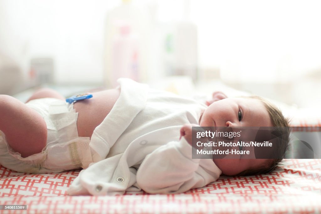 Baby lying on changing table