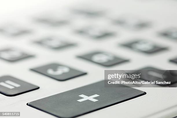 close-up of addition button on calculator - adding calculator stock pictures, royalty-free photos & images