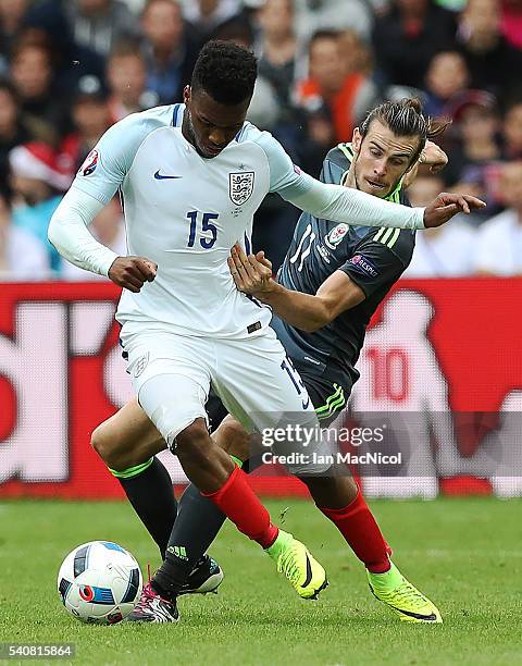 Daniel Sturridge of England vies with Gareth Bale of Wales during the UEFA EURO 2016 Group B match between England v Wales at Stade Bollaert-Delelis...